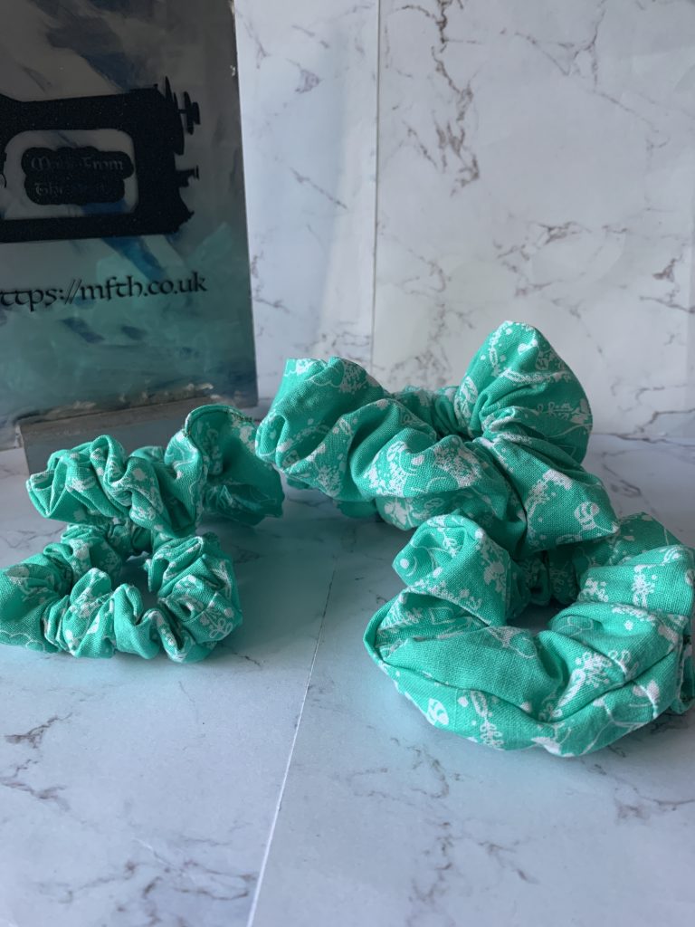 Snowman and the Dog cotton scrunchies in teal and white colouring in small and medium sizing