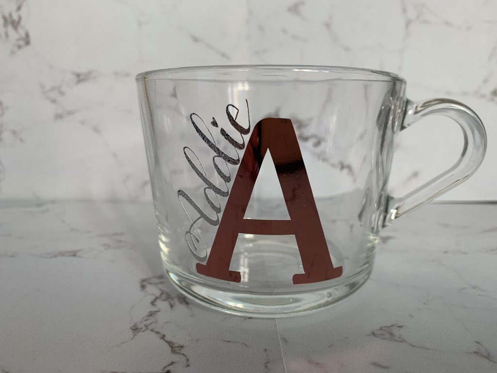 Clear mug with name and initial on it. Choice of name and colour to suit your needs