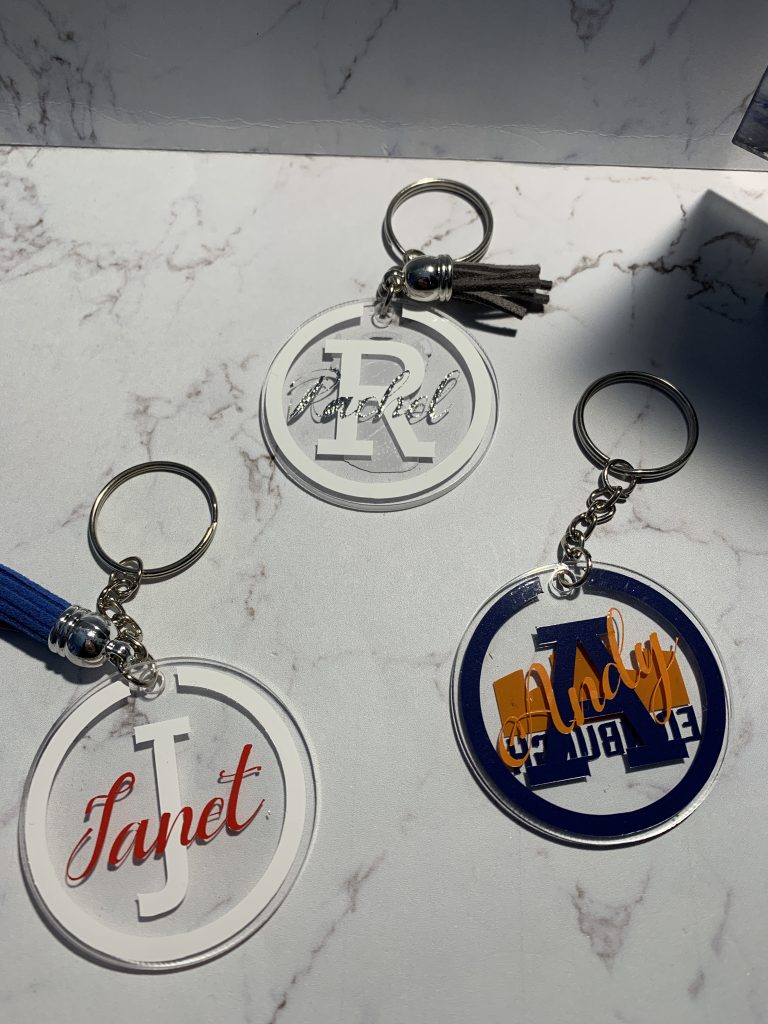 An example of 3 keyring designs created to specific custom request. Each feature initials and name and one also features the Edinburgh Rugby football logo on the reverse.