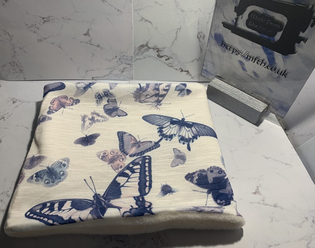 White fleece and white jersery with blue butterflies snood