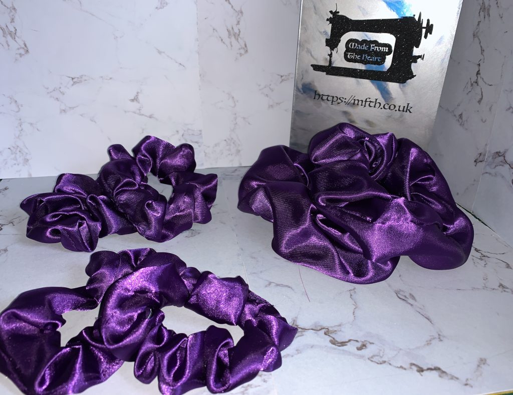 Purple satin scrunchies, available in all 3 sizes