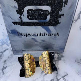 Sparkly black with holographic leopard print bow
