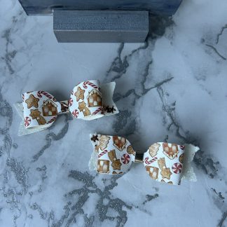 2 layer Gingerbread top with glitter backing featuring little gingerbread men theme bows