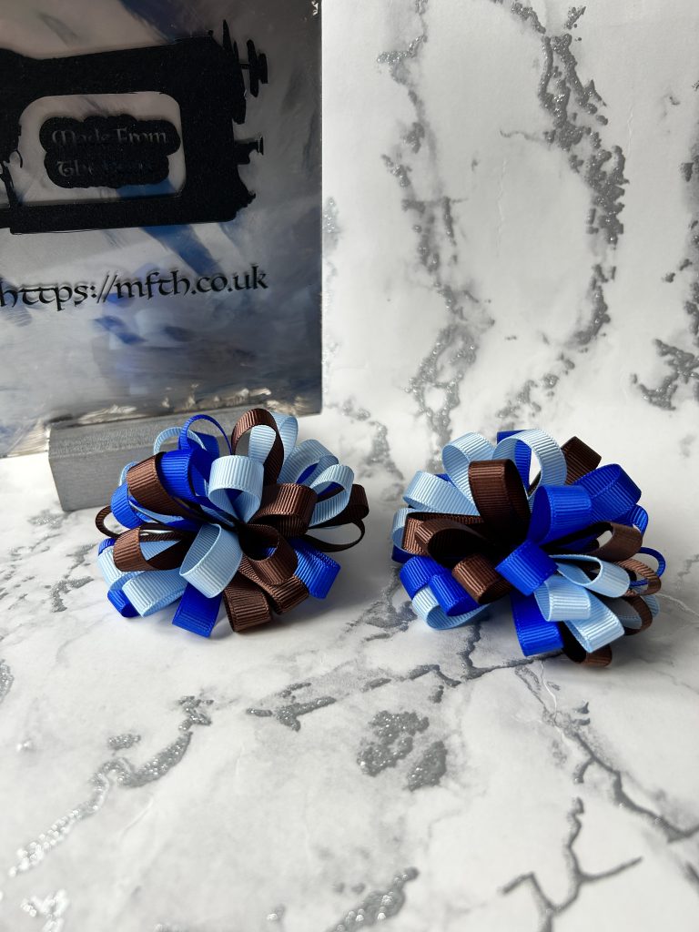 Sky blue, royal blue and brown loopy bows on clasps