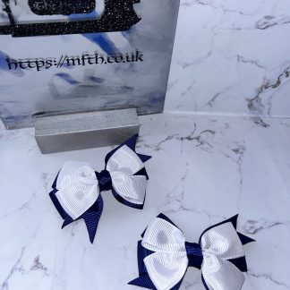 Navy backing and white double pinch bow front on clasps