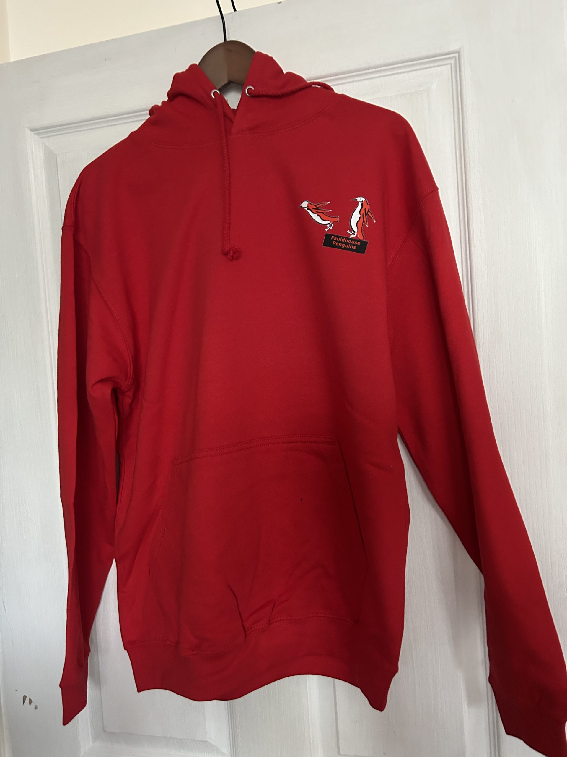 Red fleece lined with kangaroo pouch hoodie with penguins logo on right breast on black dive board